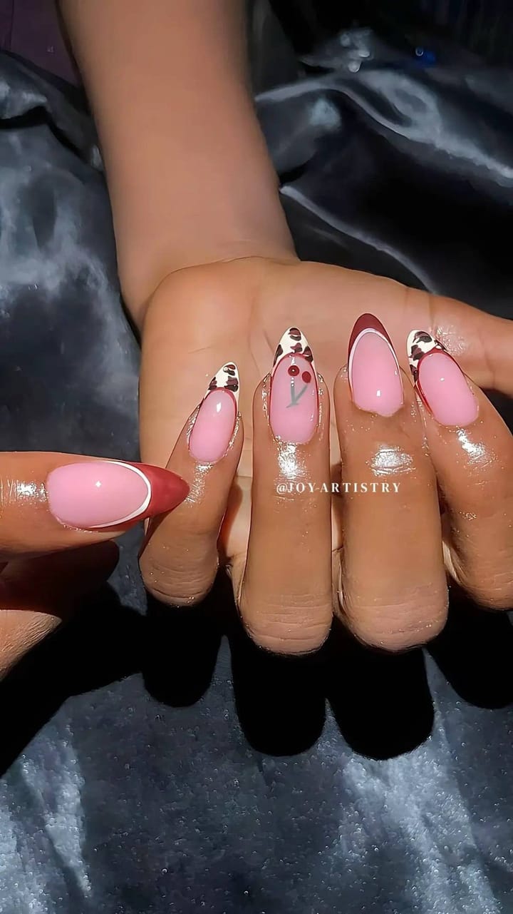 Gel X set, medium — pink almond nails with cherry art and red French tips